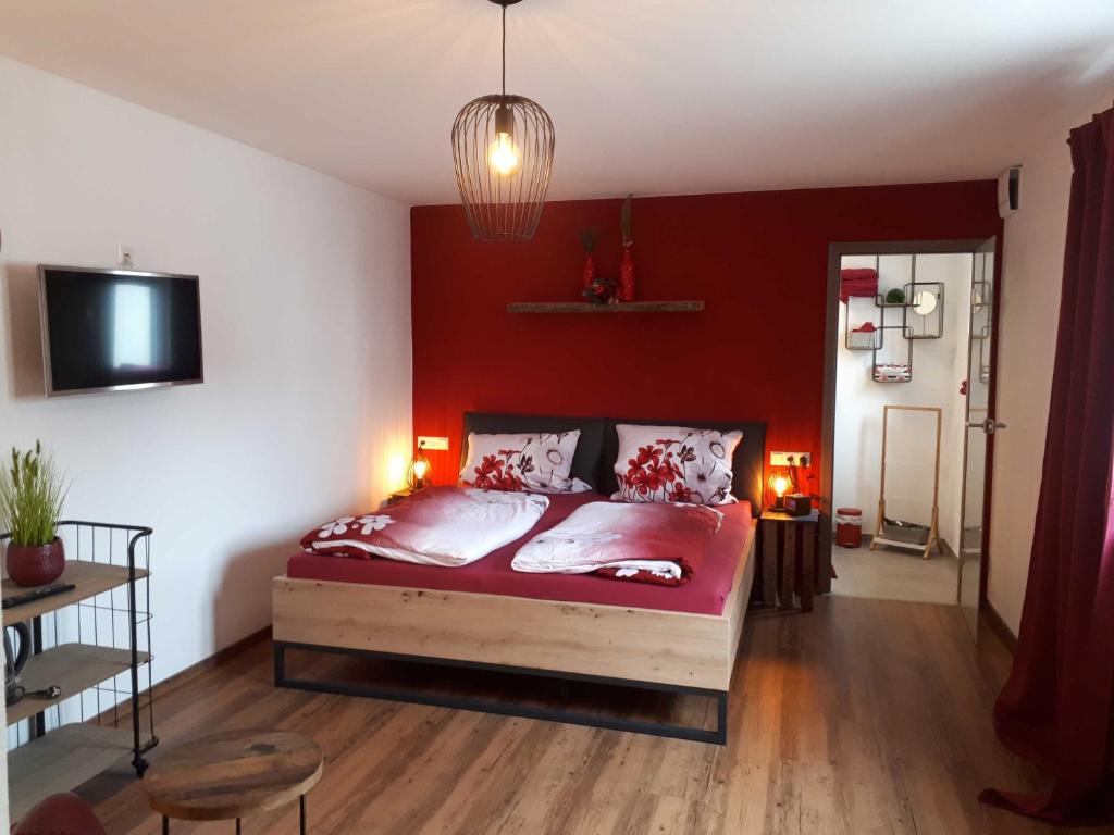Postel nebo postele na pokoji v ubytování Weinlodge am Geissberg