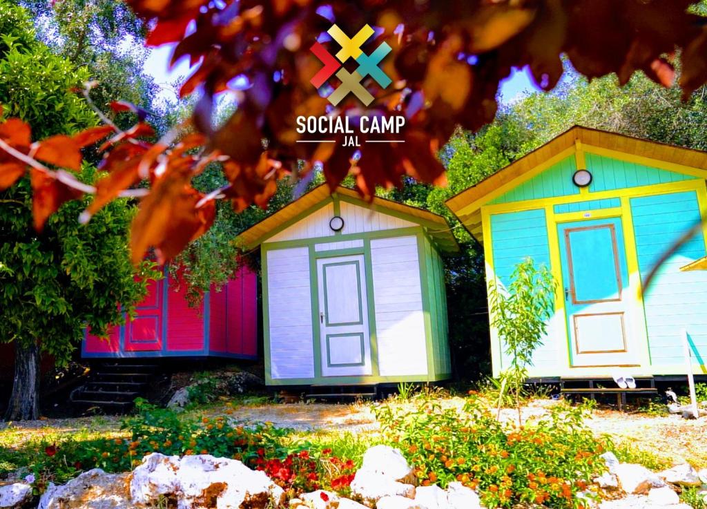 a group of small homes sitting in a yard at Social Camping JAL in Jal