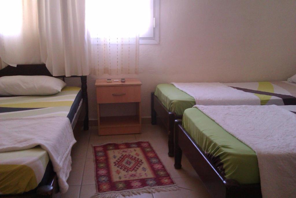 Postel nebo postele na pokoji v ubytování Pinara Pension & Guesthouse