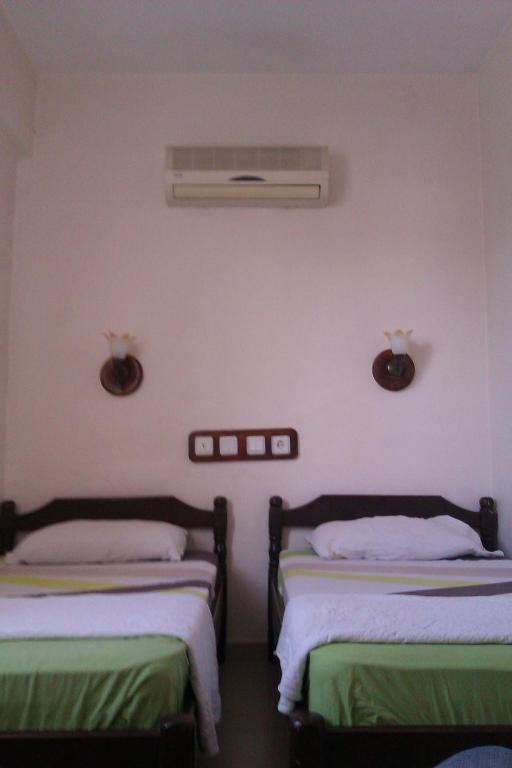 Postel nebo postele na pokoji v ubytování Pinara Pension & Guesthouse