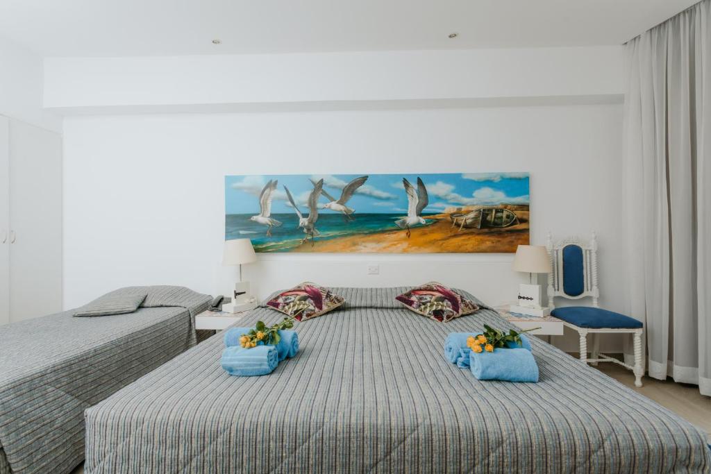 Postel nebo postele na pokoji v ubytování Hotel Opera