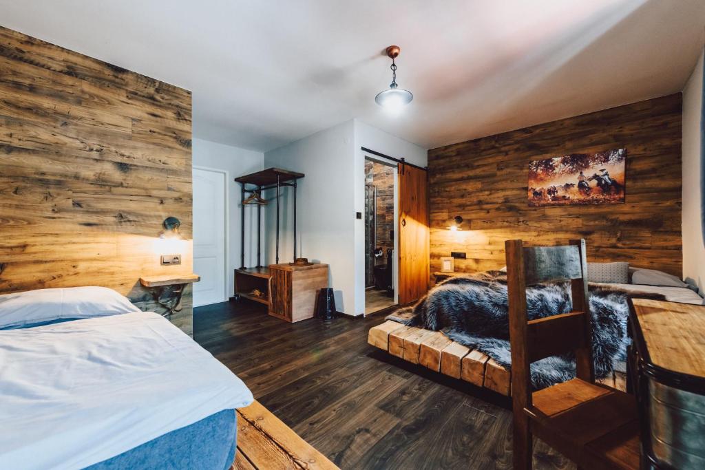 Postel nebo postele na pokoji v ubytování Resort Mlýn Černovice