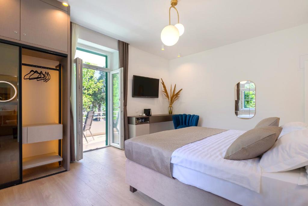 Postel nebo postele na pokoji v ubytování Green Park Luxury Rooms