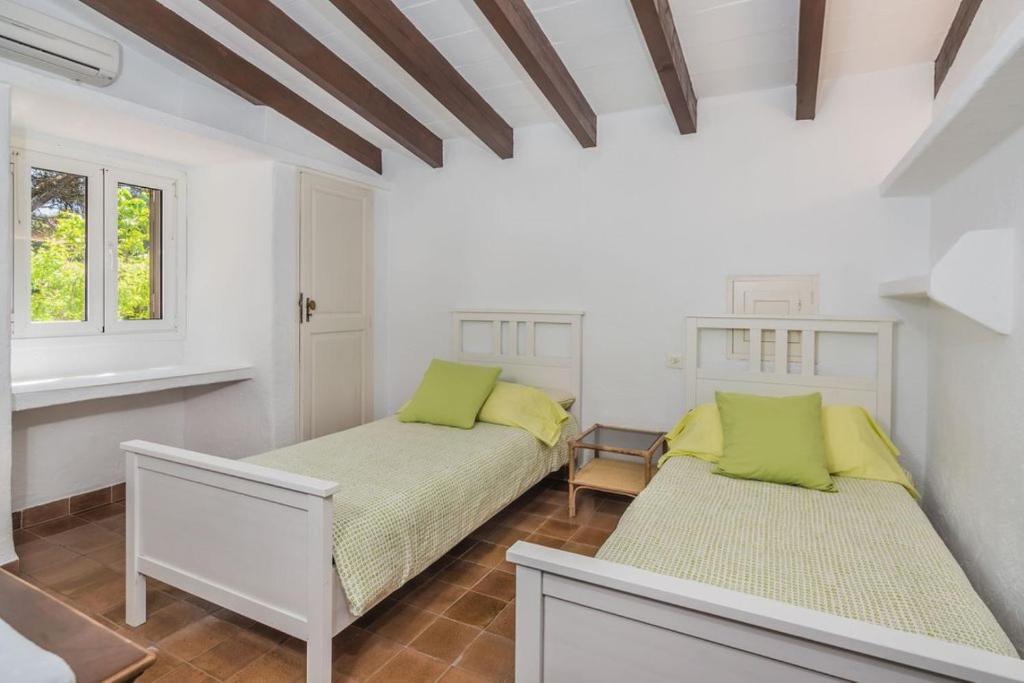 Postel nebo postele na pokoji v ubytování Villa Papalaia