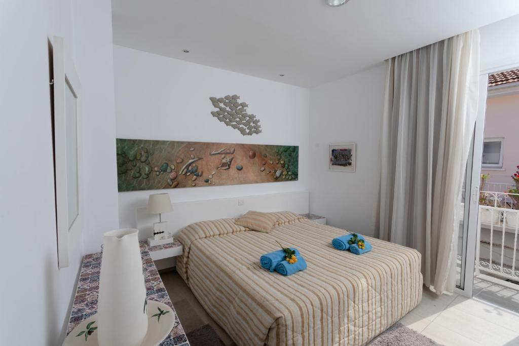 Postel nebo postele na pokoji v ubytování Hotel Opera