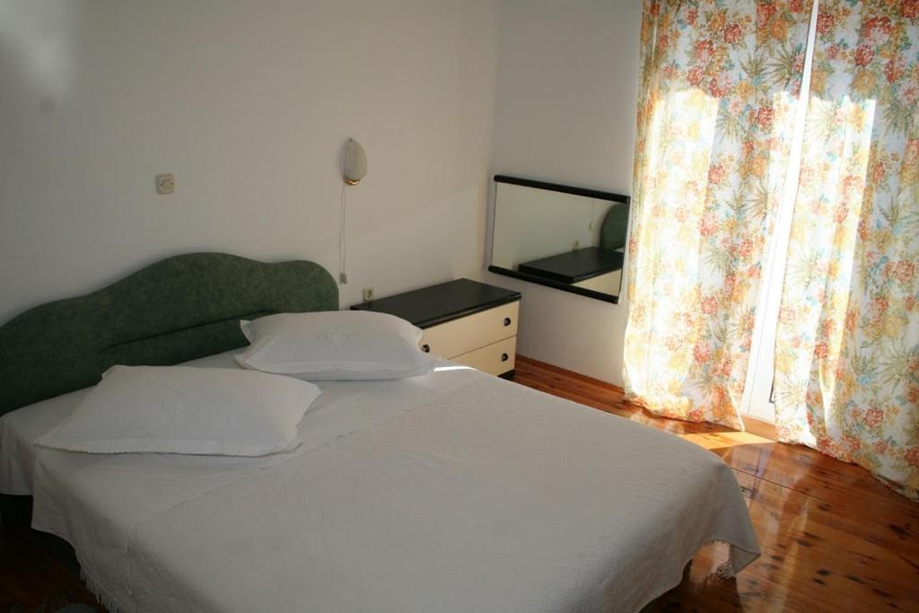 Postel nebo postele na pokoji v ubytování Apartmani Mladina