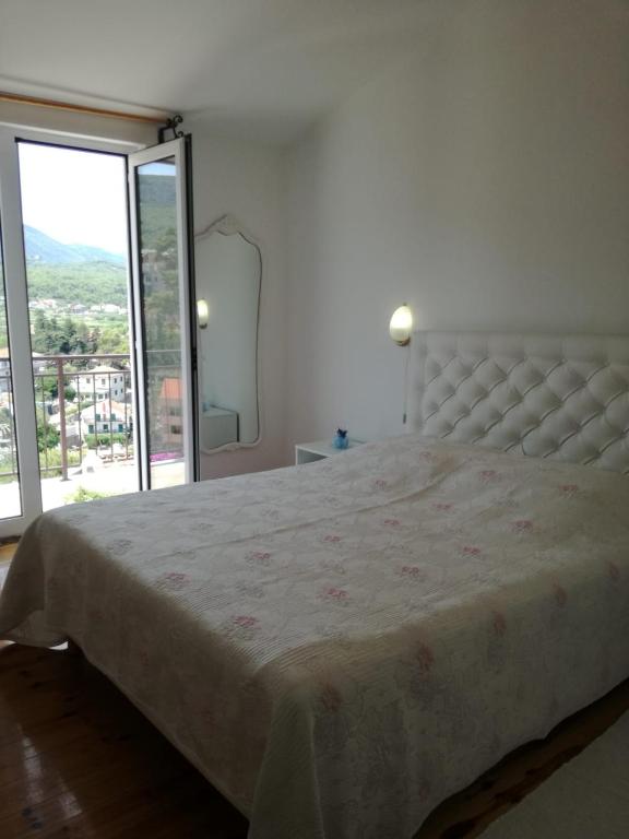 Postel nebo postele na pokoji v ubytování Apartmani Mladina