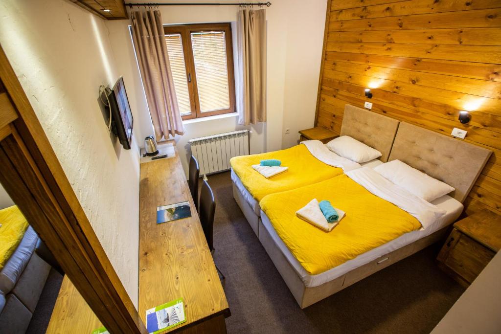 Postel nebo postele na pokoji v ubytování Apartments Tango