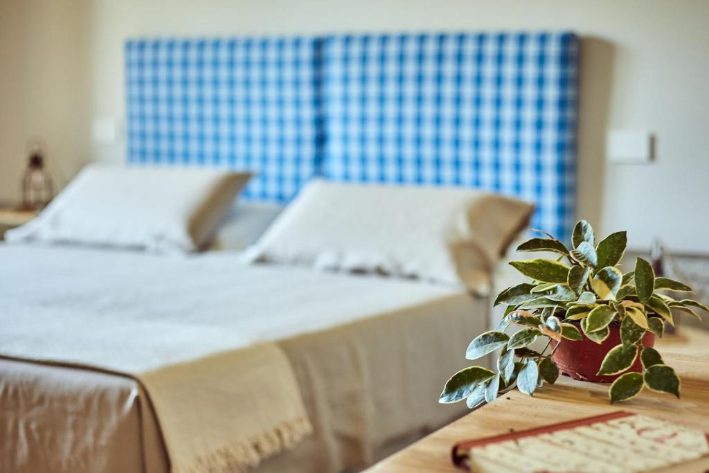 Postel nebo postele na pokoji v ubytování CUGUSI BnB