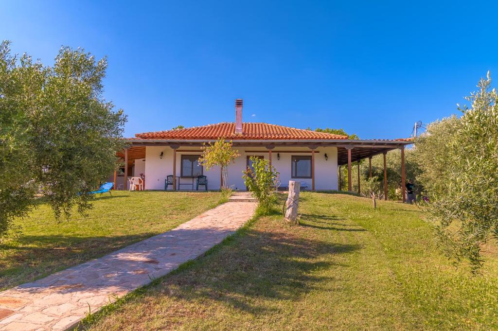 a house with a pathway in front of it at Villa Sofia in Mesimvría