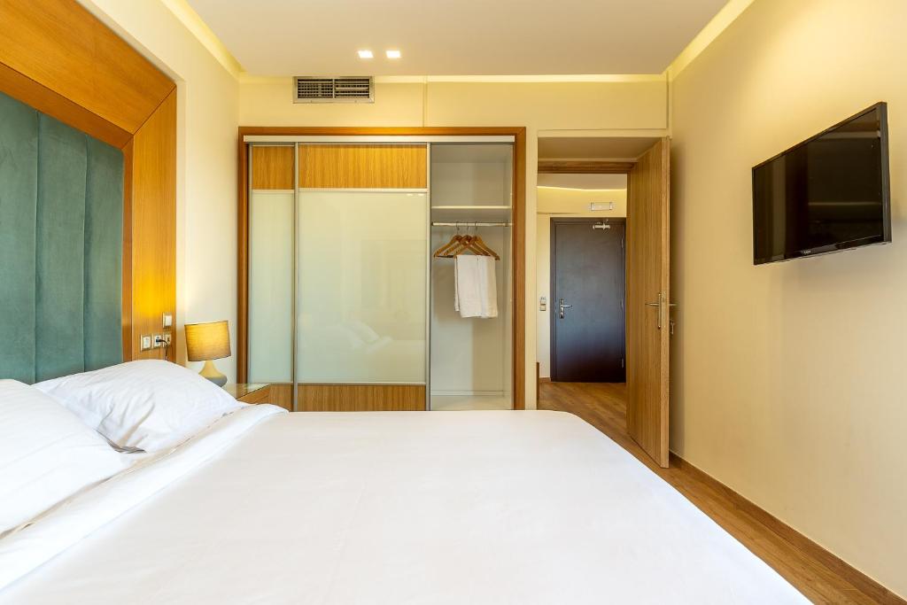 Postel nebo postele na pokoji v ubytování Oasis Hotel Apartments