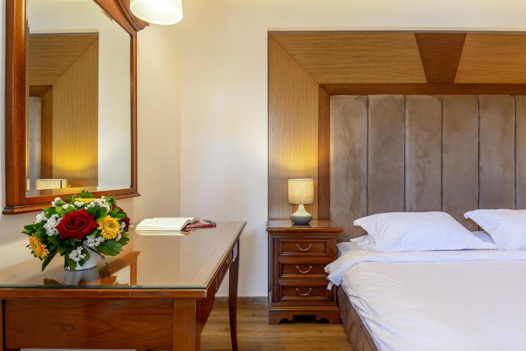 Postel nebo postele na pokoji v ubytování Oasis Hotel Apartments
