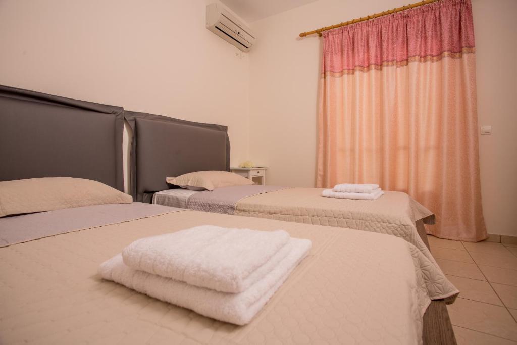 Postel nebo postele na pokoji v ubytování Pistakion Houses