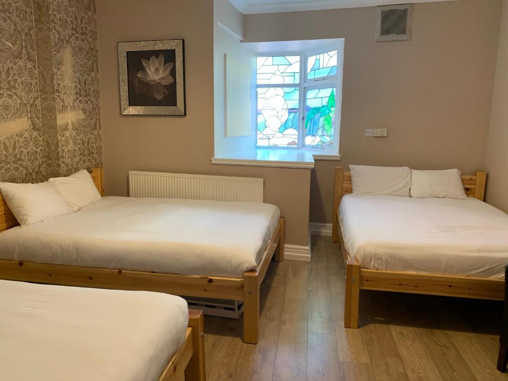 Postel nebo postele na pokoji v ubytování New Union ADULTS ONLY