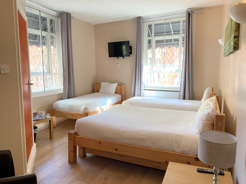 Postel nebo postele na pokoji v ubytování New Union ADULTS ONLY