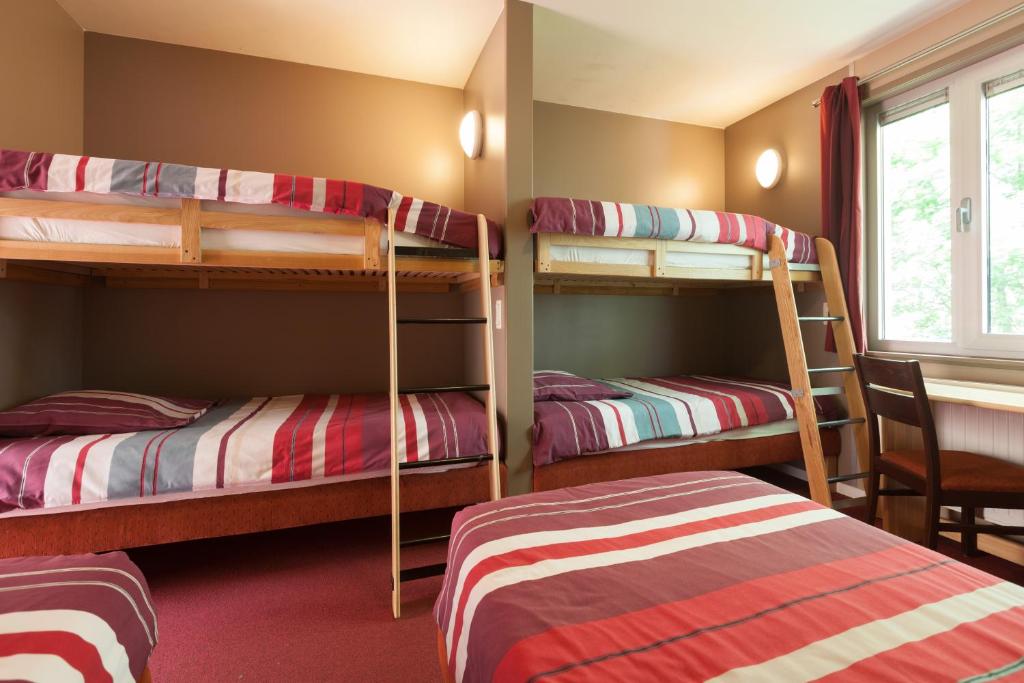 Postel nebo postele na pokoji v ubytování Flanders Lodge Hotel