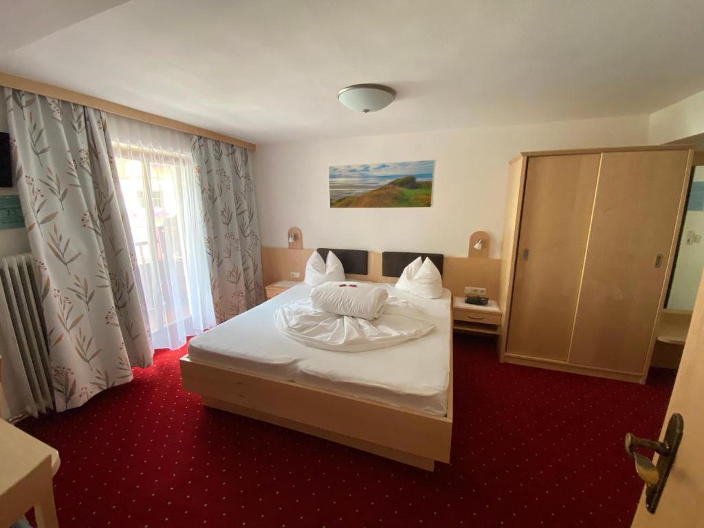 Postel nebo postele na pokoji v ubytování Hotel UNTERKRÄMERHOF