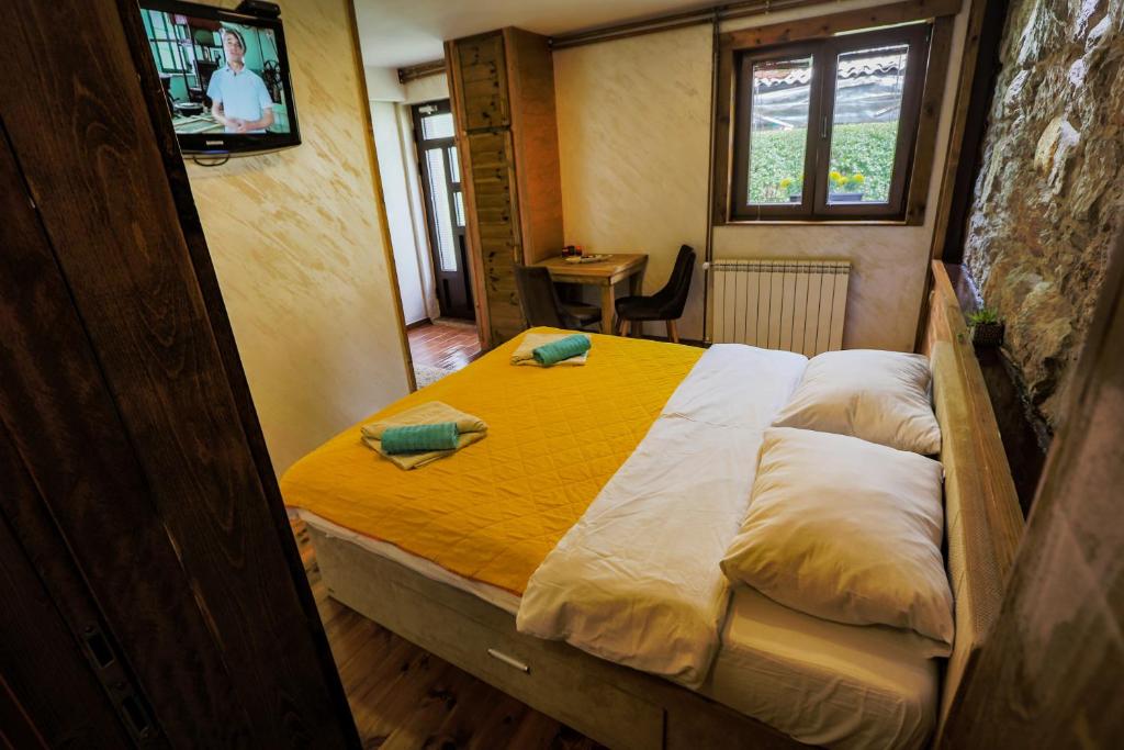 Postel nebo postele na pokoji v ubytování Apartments Tango