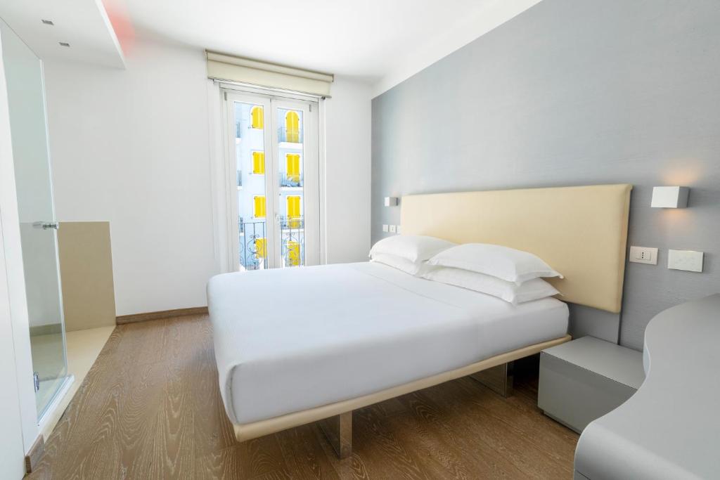 Postel nebo postele na pokoji v ubytování Life Hotel Seaview & Spa