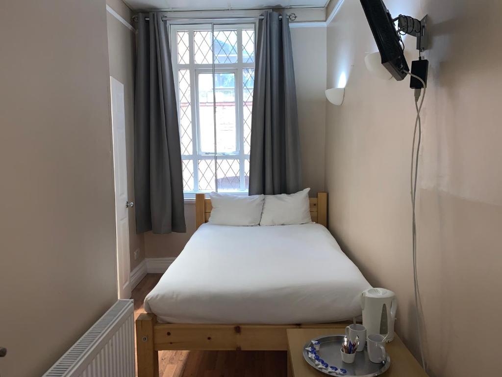 Postel nebo postele na pokoji v ubytování New Union ADULTS ONLY