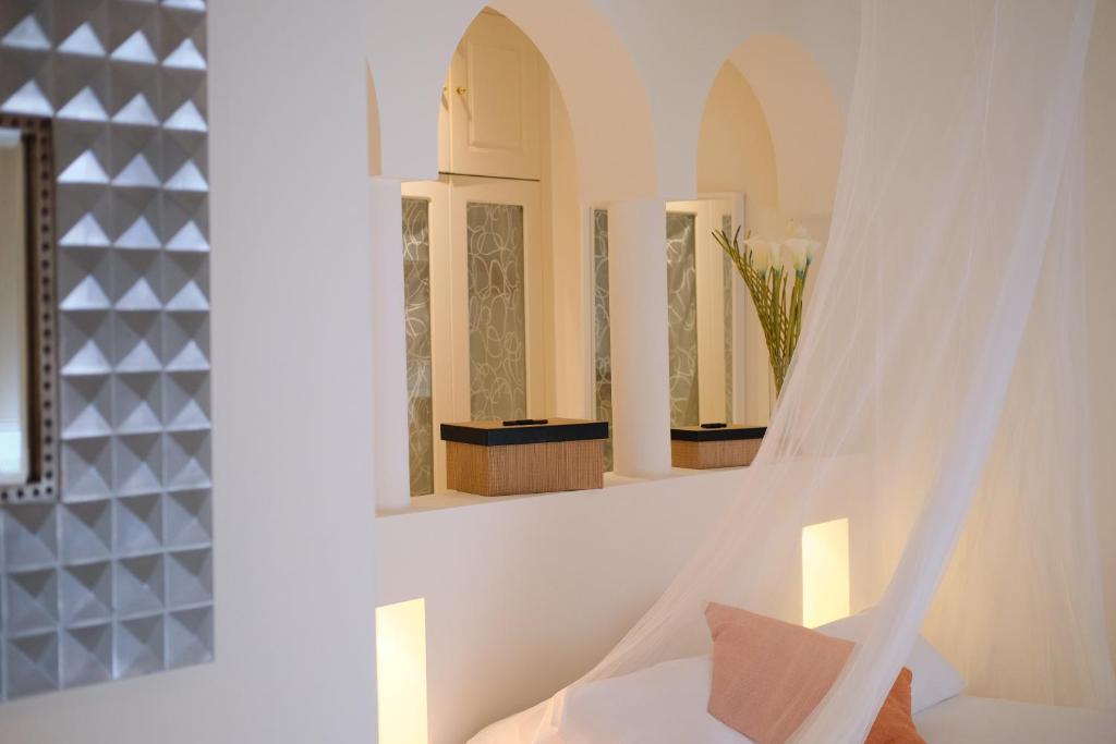 Posteľ alebo postele v izbe v ubytovaní KATIS Villas Boutique in Bahiazul
