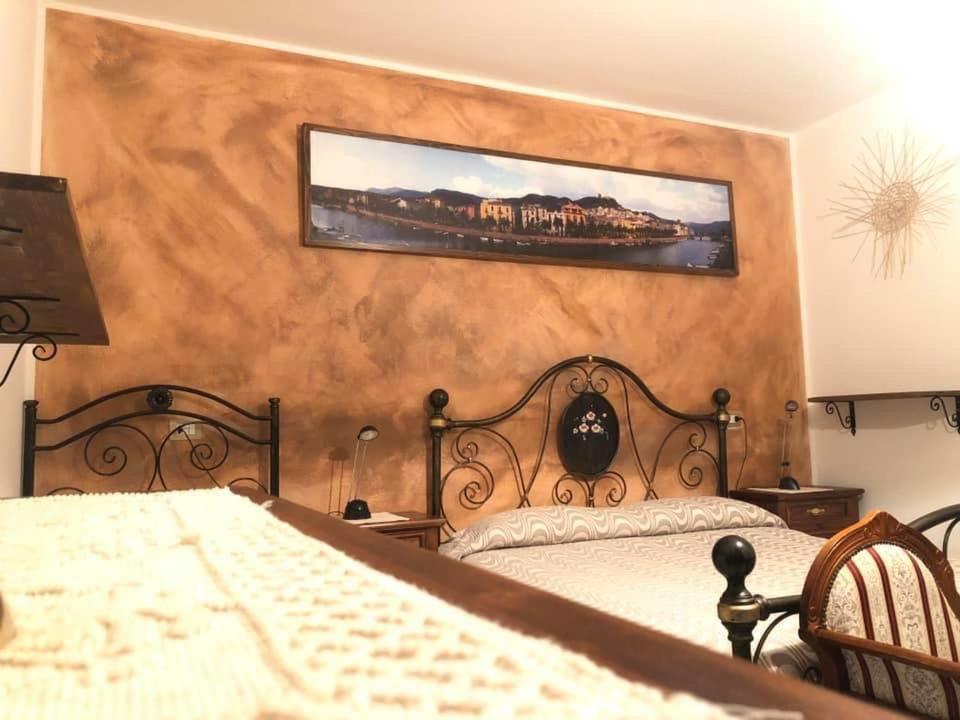 Postel nebo postele na pokoji v ubytování B&B I Gerani