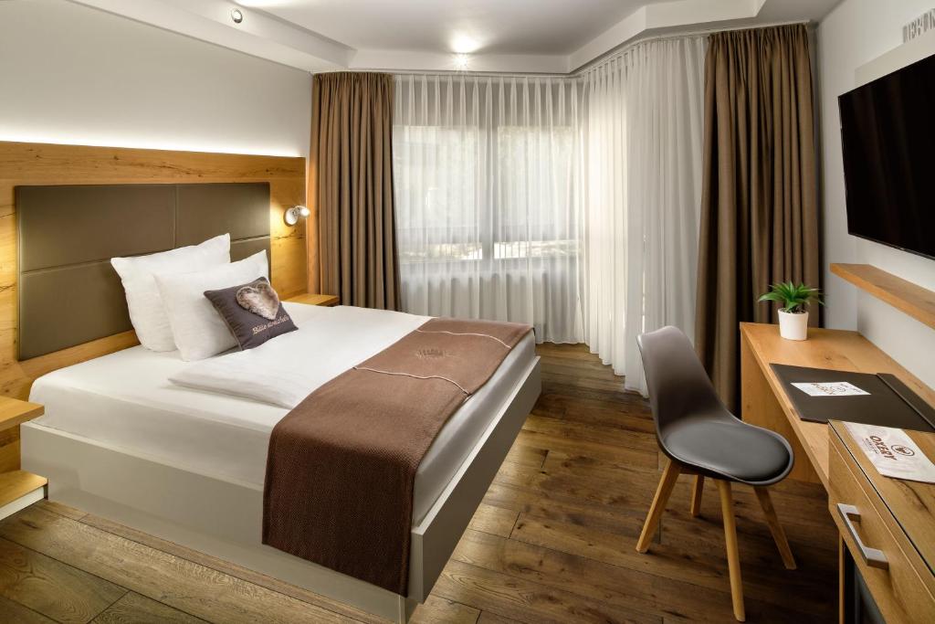 Ein Bett oder Betten in einem Zimmer der Unterkunft Neo Hotel Linde Esslingen