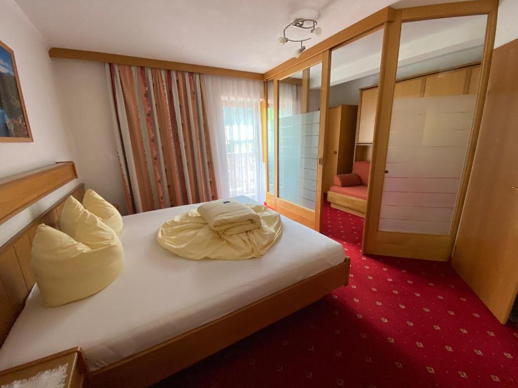 Postel nebo postele na pokoji v ubytování Hotel UNTERKRÄMERHOF
