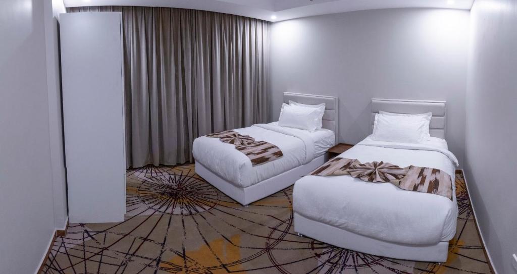 Postel nebo postele na pokoji v ubytování Seven Gardens Hotel
