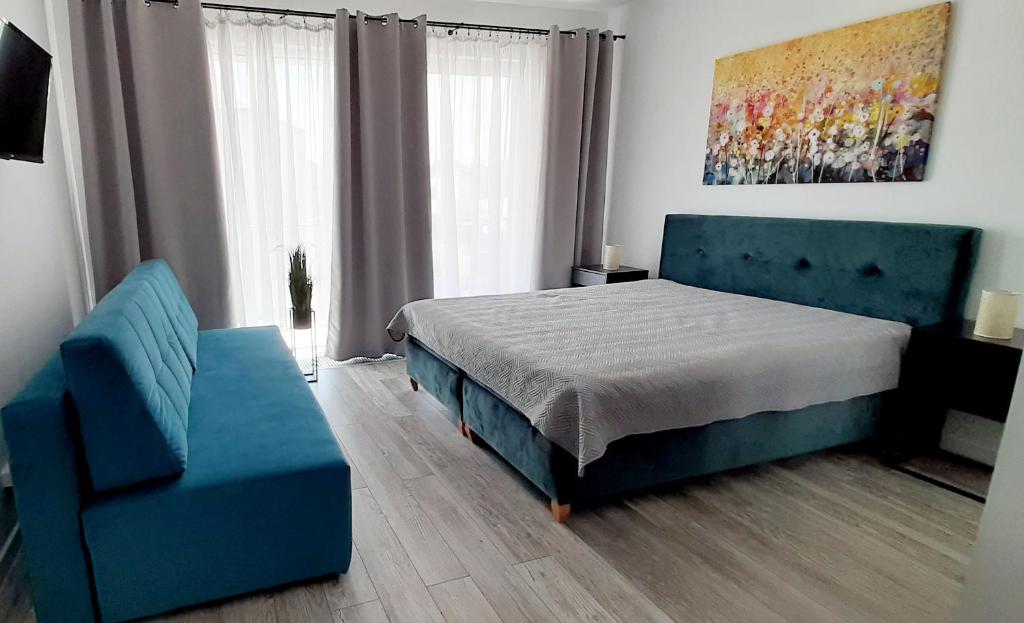 Postel nebo postele na pokoji v ubytování Flamingo Apartments