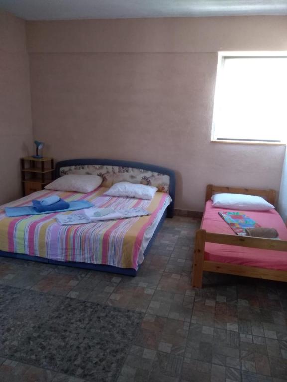 Posteľ alebo postele v izbe v ubytovaní Apartment Bušljeta