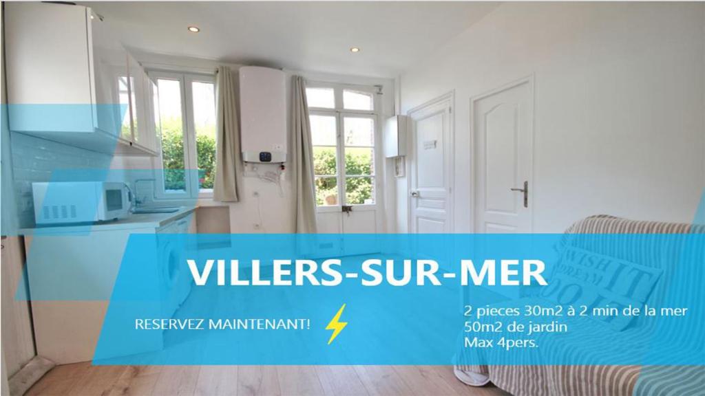 a kitchen with a blue sign that reads villers sur mer at Villers-sur-Mer in Villers-sur-Mer