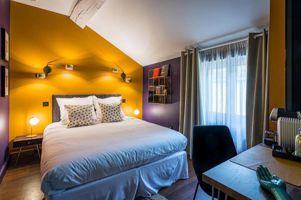 Postel nebo postele na pokoji v ubytování Hôtel - Restaurant Le Globe