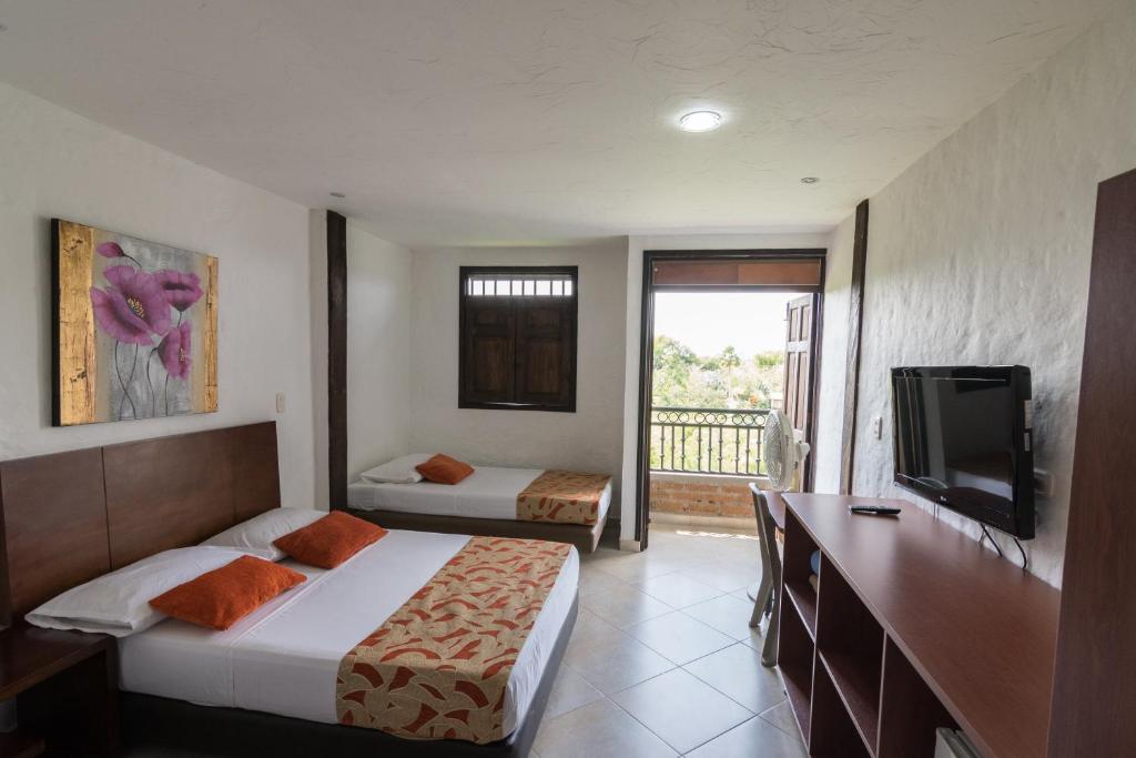Postel nebo postele na pokoji v ubytování Finca Hotel La Esperanza