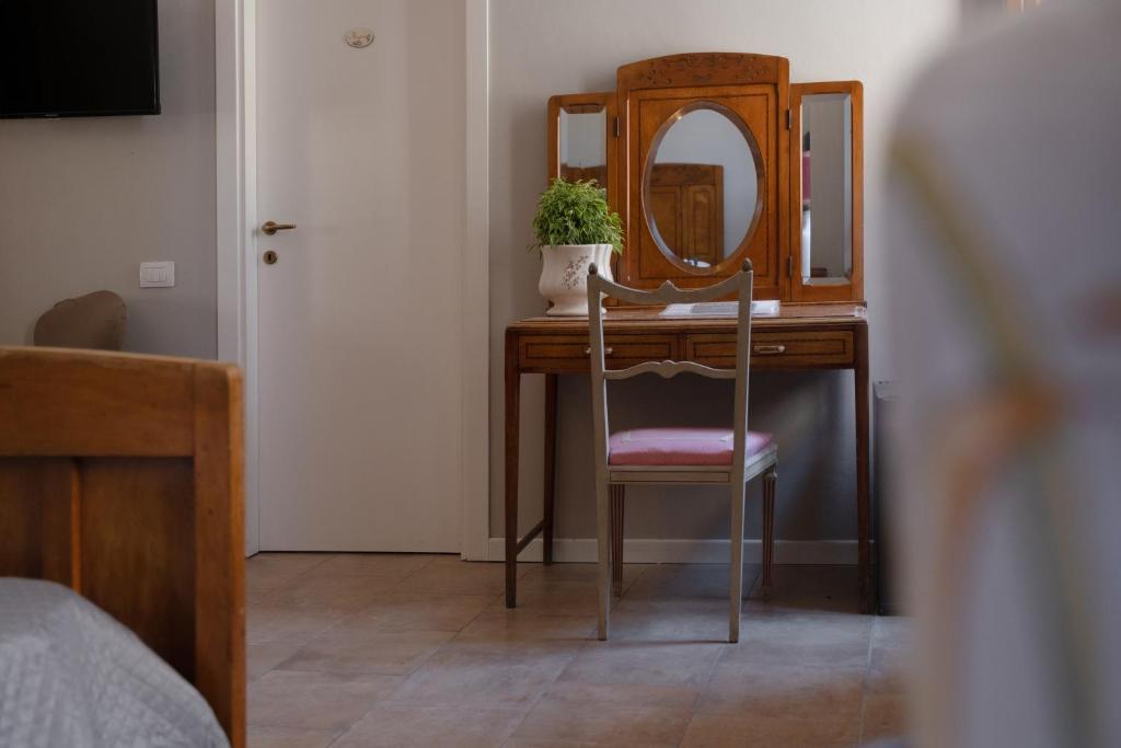 Postel nebo postele na pokoji v ubytování Città Di Castello Rooms