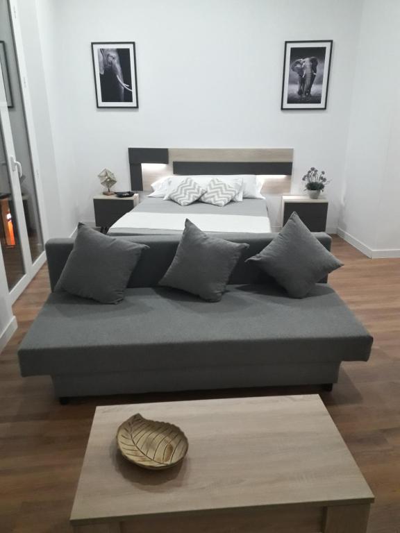 A bed or beds in a room at Pastor Design Suites