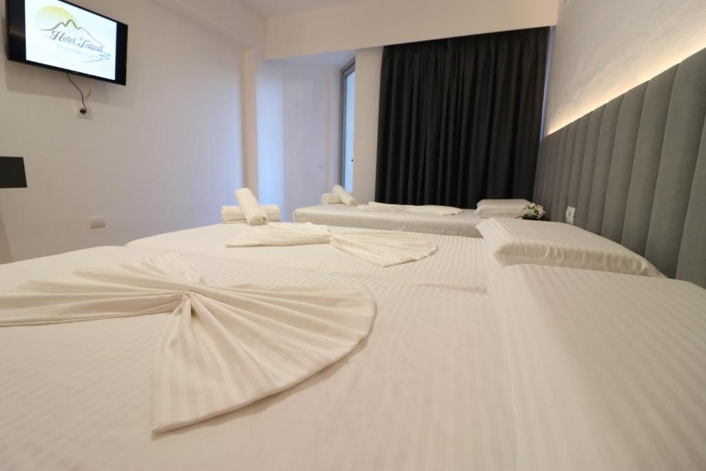 Postel nebo postele na pokoji v ubytování Hotel Tatzati 2