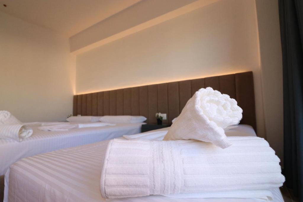 Postel nebo postele na pokoji v ubytování Hotel Tatzati 2