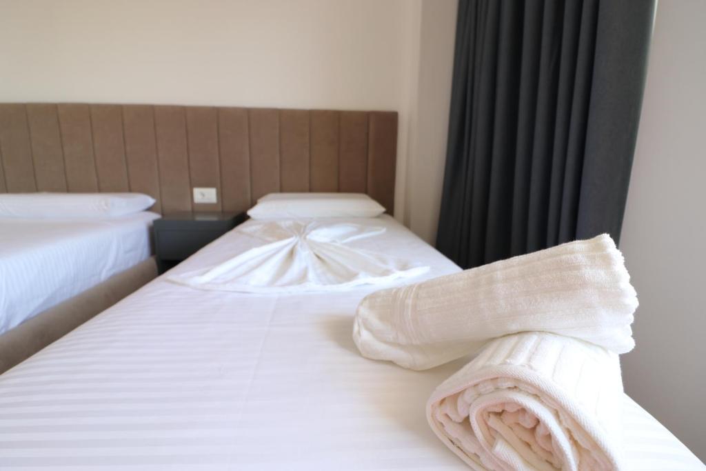 Postel nebo postele na pokoji v ubytování Hotel Tatzati 2