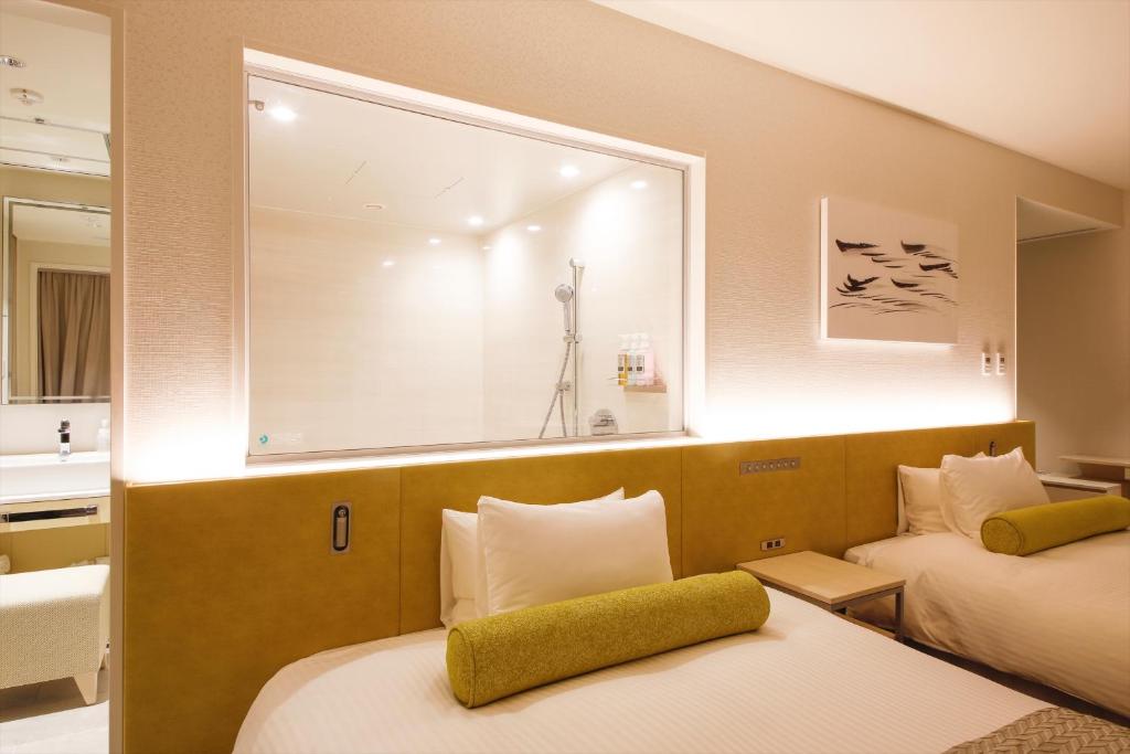 Postel nebo postele na pokoji v ubytování Hotel Nikko Himeji