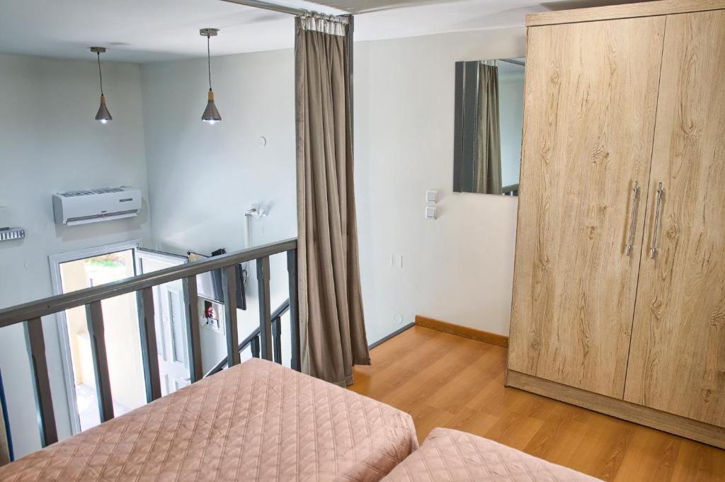 Postel nebo postele na pokoji v ubytování Haraki Sand Beach