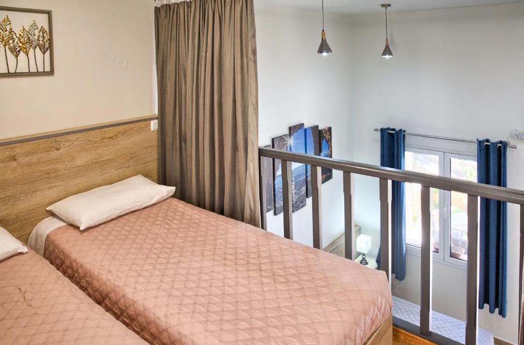 Postel nebo postele na pokoji v ubytování Haraki Sand Beach