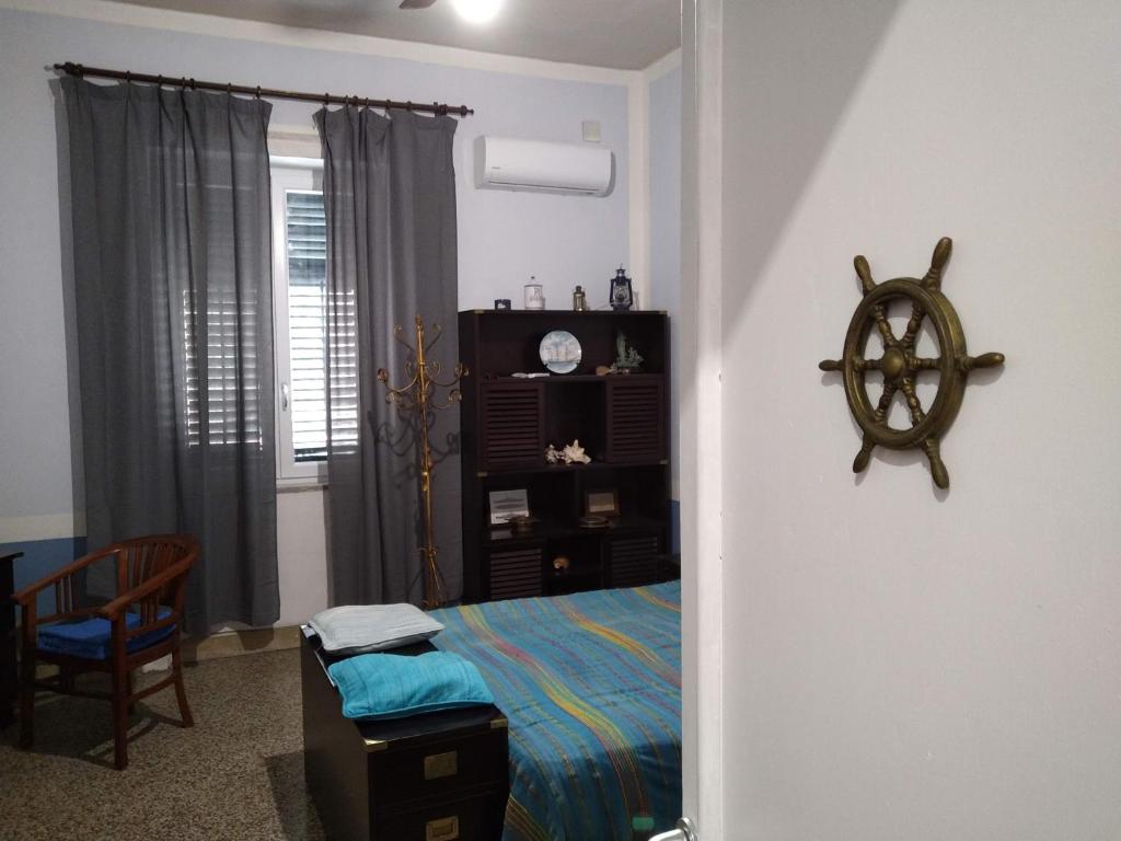 Postel nebo postele na pokoji v ubytování Il Genio del Porto - Mabbonath b&b
