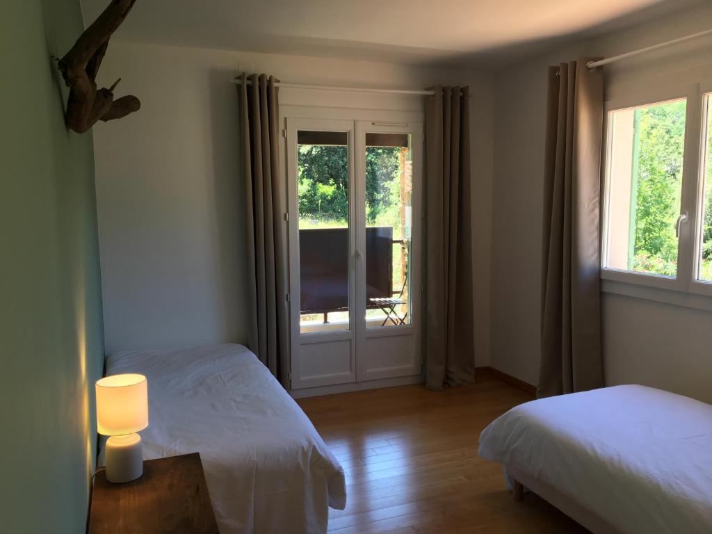 Postel nebo postele na pokoji v ubytování Villa Bonheur Vallespir
