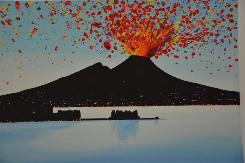 a painting of a mountain with a fire explosion at SoLuMa' Chiaja Rooms in Naples