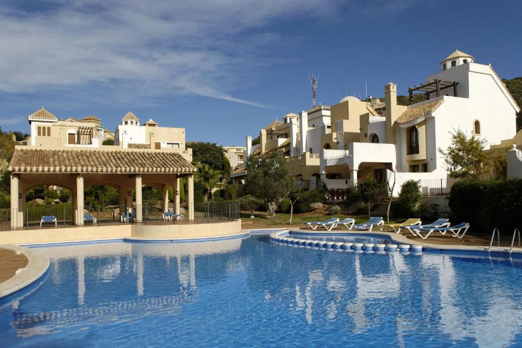 a large swimming pool in front of a building at La Manga Club Resort - Monte Claro 445 in Atamaría