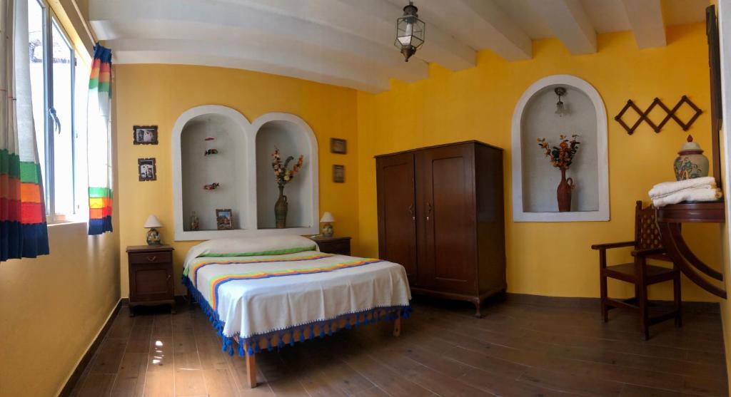 Postel nebo postele na pokoji v ubytování Casa Tecolote
