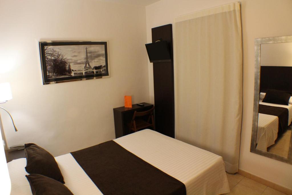 Postel nebo postele na pokoji v ubytování Hotel Marfany