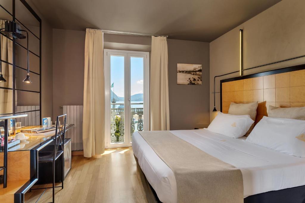 Postel nebo postele na pokoji v ubytování Hotel Ancora