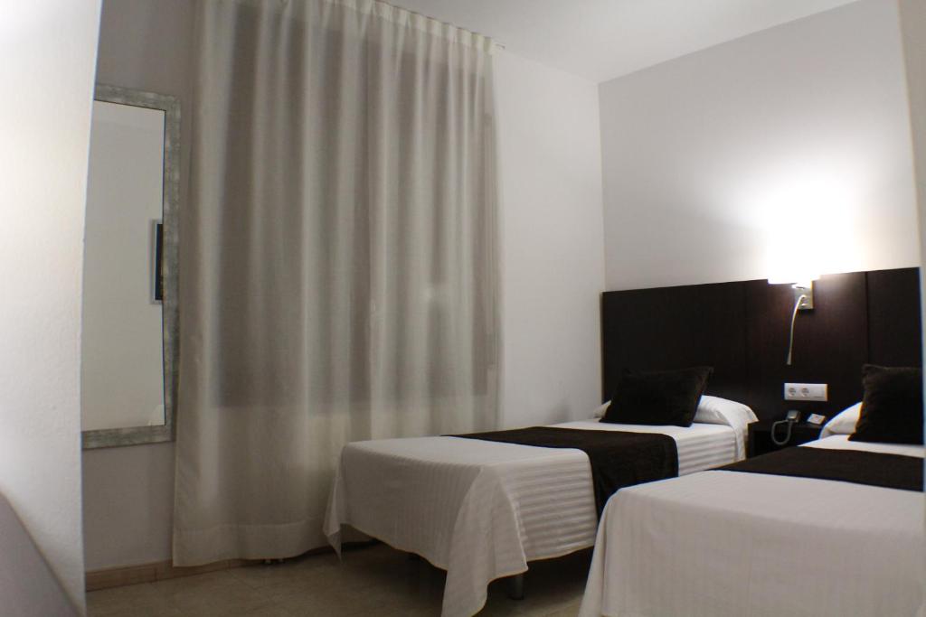 Postel nebo postele na pokoji v ubytování Hotel Marfany